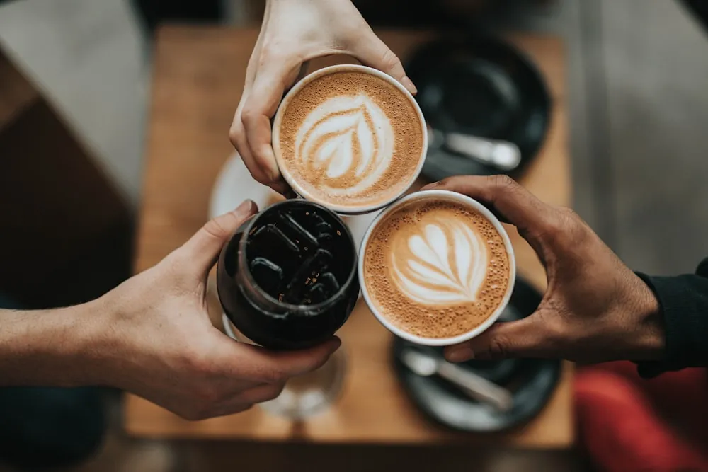 Three freshly prepared coffee drinks